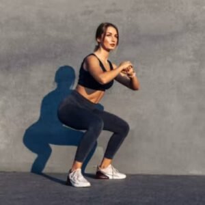 A woman is showing squats leg extension alternatives pose